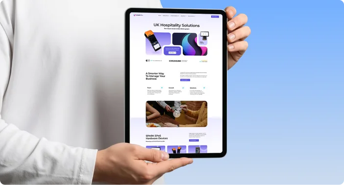 Spark Epos website shown on a tablet held in two hands
